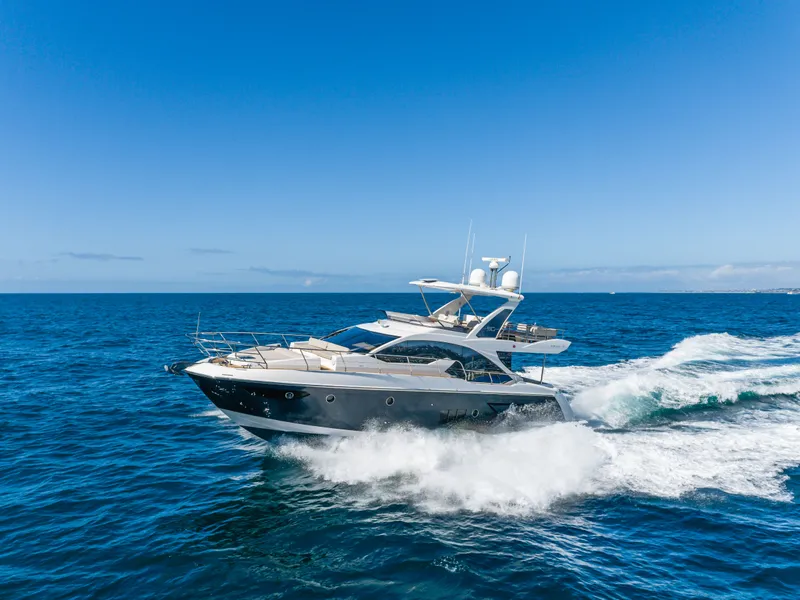 Slide: The Image of Azimut 50 Fly 2015 yacht cruising on open sea under clear sky. - 15