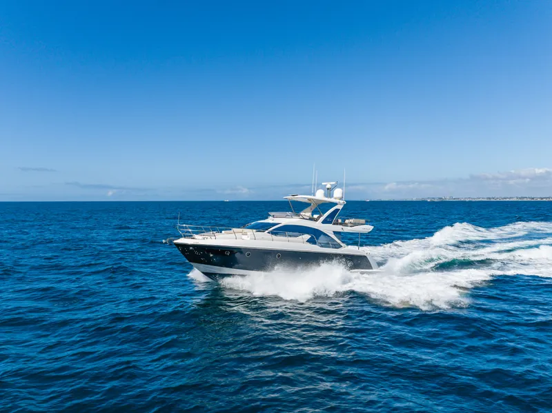 Slide: The Image of Azimut 50 Fly 2015 yacht cruising on open sea under clear sky. - 16