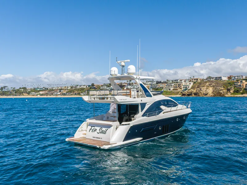 Slide: The Image of Azimut 50 Fly 2015 yacht on open sea near coastline. - 8