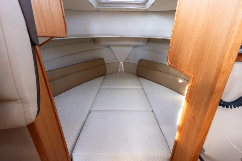 Slide: The Image of 2012 Ranger Tugs R-25 SC cabin interior with cozy sleeping area. - 9