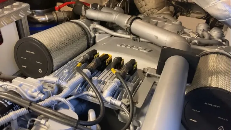 Slide: The Image of Engine room of a 2015 Pershing 70 with complex components. - 3