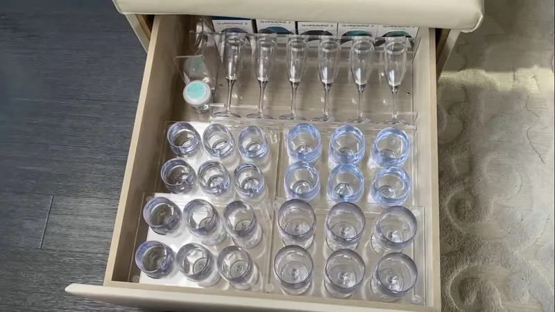 Slide: The Image of Glasses in a drawer on a 2015 Pershing 70 yacht. - 7