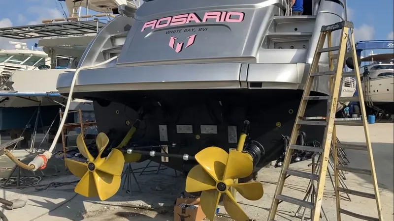 Slide: The Image of 2015 Pershing 70 yacht with yellow propellers in dry dock. - 9