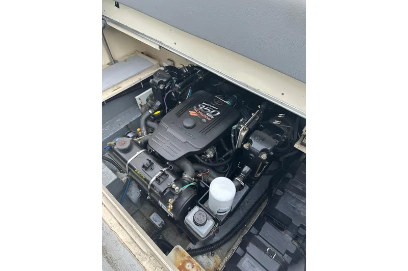 The Image of Engine compartment of a 1985 Sea Ray 255 SVR boat, showcasing the motor details. - 1