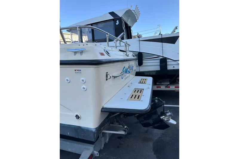 Slide: The Image of 1985 Sea Ray 255 SVR boat, rear view with swim platform and propeller. - 8