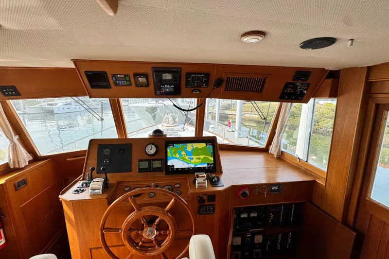 Slide: The Image of Interior helm of 2000 Grand Banks 52 Europa yacht with navigation equipment. - 12
