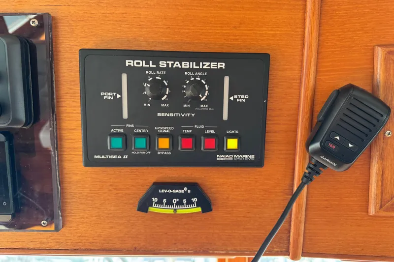 Slide: The Image of Control panel of a 2000 Grand Banks 52 Europa with roll stabilizer and Garmin microphone. - 18