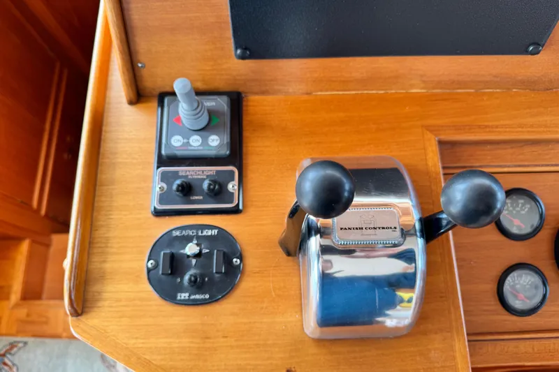 Slide: The Image of Control panel of 2000 Grand Banks 52 Europa yacht with searchlight and throttle controls. - 19