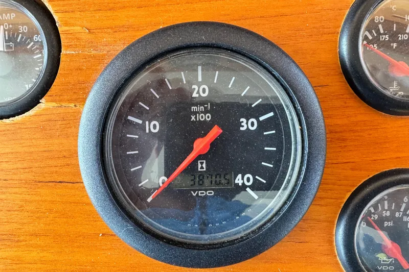 Slide: The Image of Tachometer on 2000 Grand Banks 52 Europa boat dashboard, showing 3870.5 hours. - 24