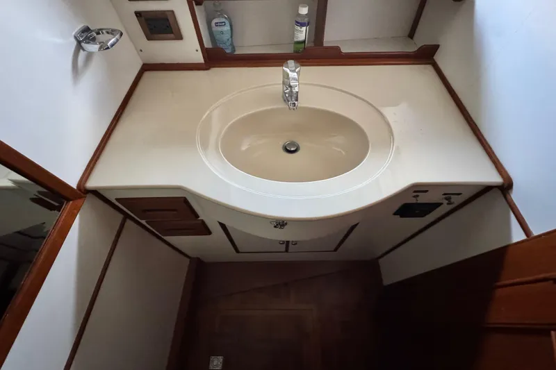 Slide: The Image of Bathroom sink area on a 2000 Grand Banks 52 Europa yacht. - 32