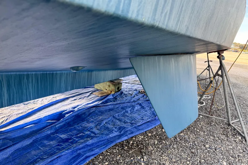 Slide: The Image of Underside view of 2000 Grand Banks 52 Europa yacht on blue tarp. - 42