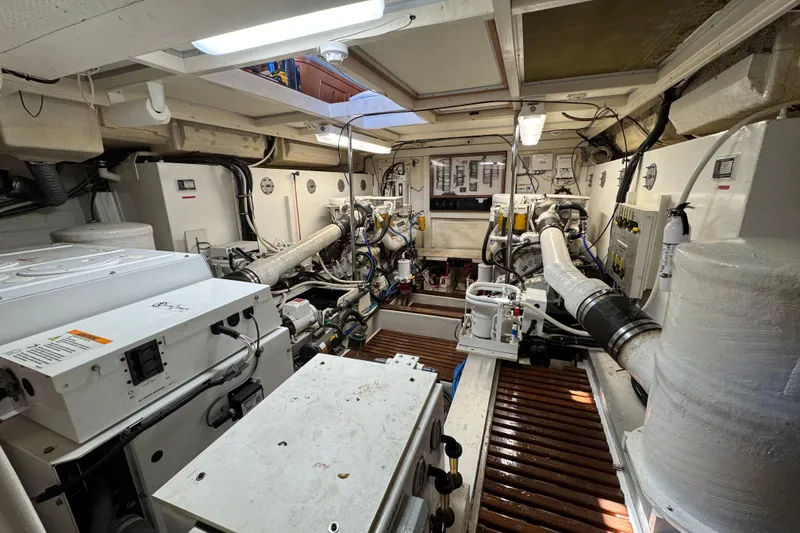 Slide: The Image of Engine room of 2000 Grand Banks 52 Europa yacht, showcasing mechanical systems and equipment. - 48