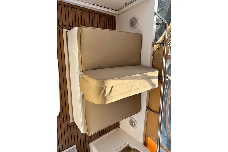Slide: The Image of Grand Banks 52 Europa 2000 yacht interior with beige cushions and wooden flooring. - 54