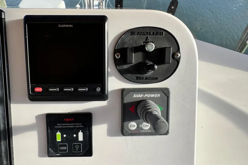 Slide: The Image of Control panel of a 2000 Grand Banks 52 Europa with Garmin display and Side-Power thruster. - 55