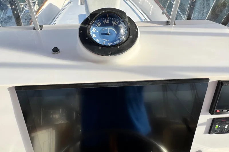 Slide: The Image of Compass and dashboard on 2000 Grand Banks 52 Europa yacht. - 57