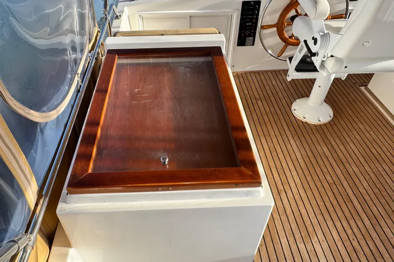 Slide: The Image of Helm area of 2000 Grand Banks 52 Europa with wooden accents and seating. - 63