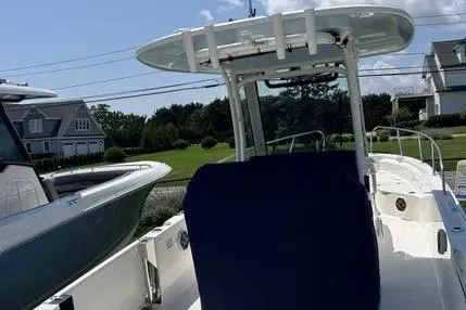 Slide: The Image of 2023 Boston Whaler 280 Dauntless boat docked outdoors on a sunny day. - 16