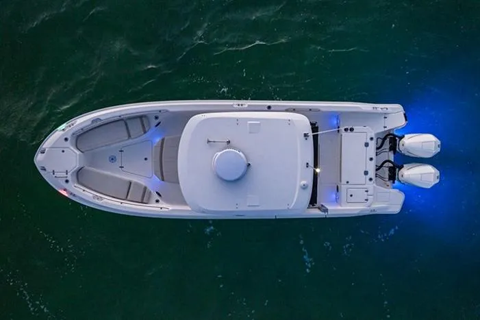 Slide: The Image of Manufacturer Provided Image: Aerial view of 2023 Boston Whaler 280 Dauntless boat with blue underwater lights. - 2