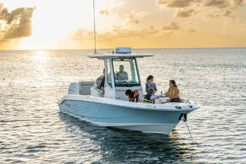 Slide: The Image of Manufacturer Provided Image: 2023 Boston Whaler 280 Dauntless boat cruising at sunset with passengers. - 3
