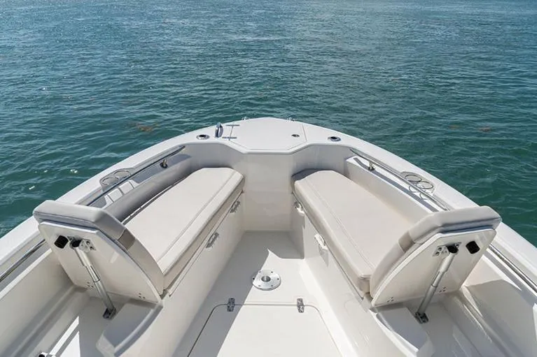 Slide: The Image of Manufacturer Provided Image: 2023 Boston Whaler 280 Dauntless boat bow seating area on water. - 8