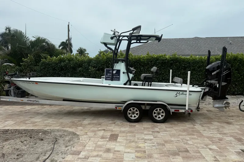 The Image of 2020 Yellowfin 24 Bay CE boat on trailer, parked outdoors. - 0
