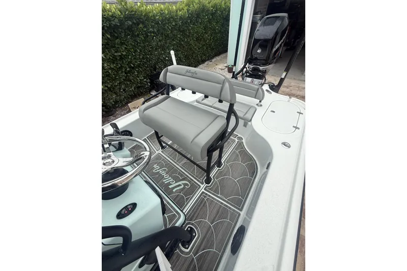 Slide: The Image of 2020 Yellowfin 24 Bay CE boat interior with seating and steering wheel. - 3