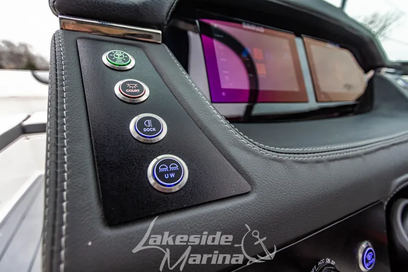 Slide: The Image of Dashboard of 2026 Chaparral SSX 4 boat with control buttons and digital display. - 13