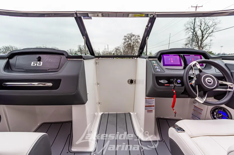 Slide: The Image of Interior view of 2026 Chaparral SSX 4 boat with modern dashboard and steering wheel. - 24