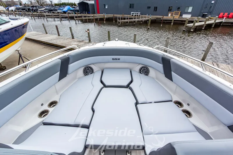 Slide: The Image of 2026 Chaparral SSX 4 boat interior with spacious seating at a marina dock. - 33