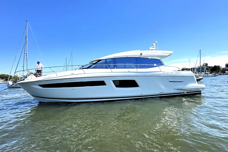 The Image of 2016 Prestige 500S yacht on calm water under clear blue sky. - 0