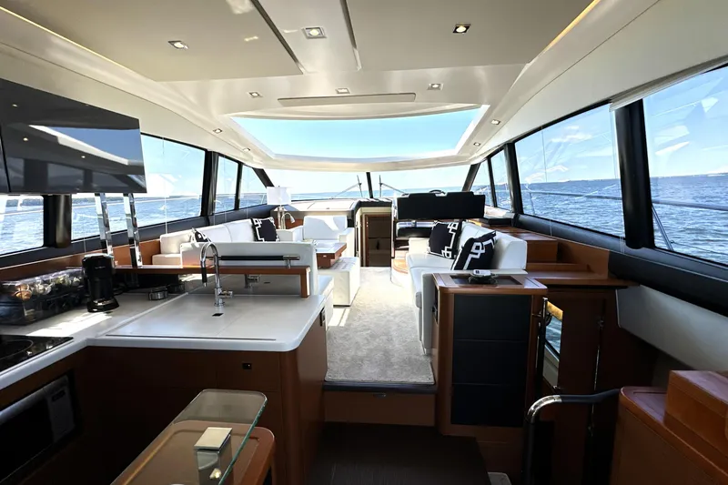 Slide: The Image of Luxurious interior of 2016 Prestige 500S yacht with modern furnishings and ocean view. - 14