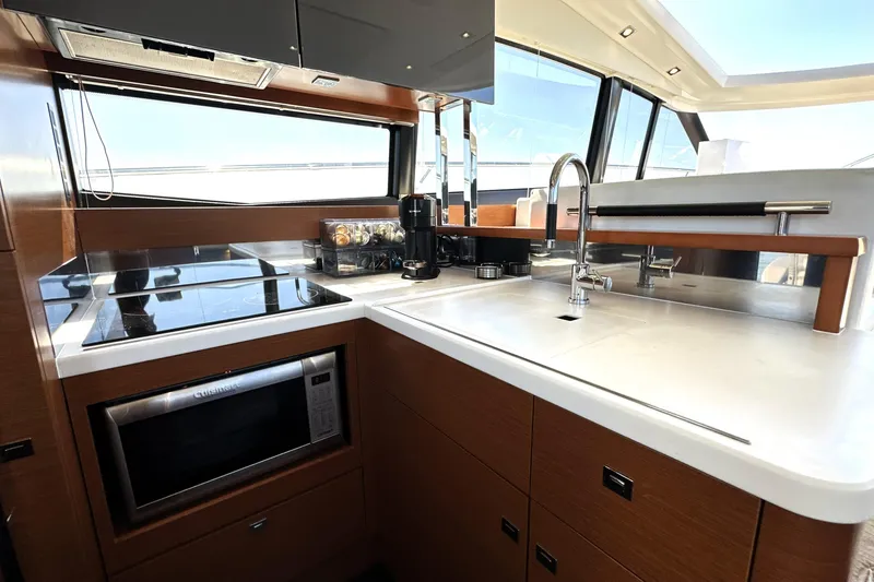 Slide: The Image of Modern kitchen interior of 2016 Prestige 500S yacht with sleek appliances and ample counter space. - 17