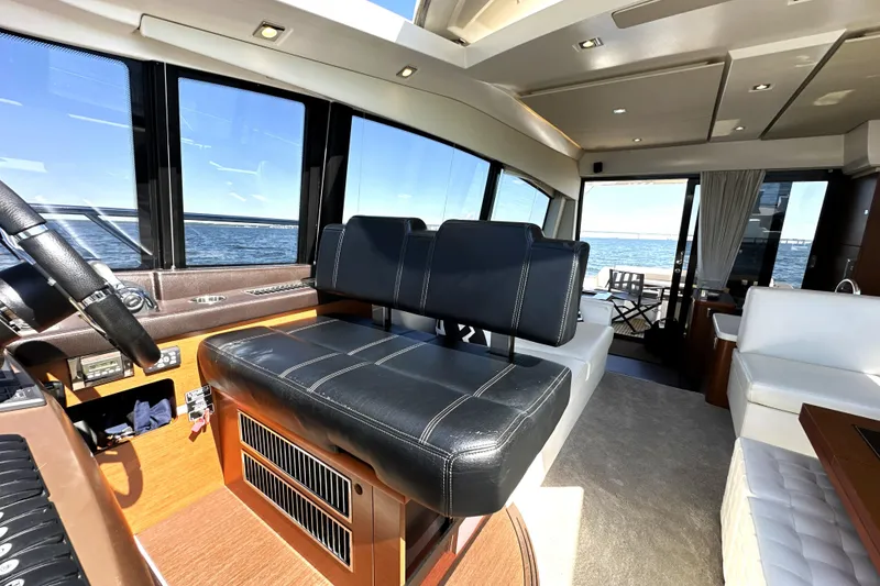 Slide: The Image of Interior of 2016 Prestige 500S yacht with leather seating and ocean view. - 24