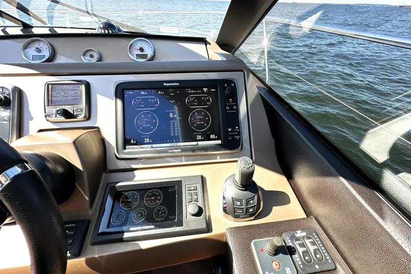 Slide: The Image of Cockpit of 2016 Prestige 500S yacht with navigation and control systems. - 28