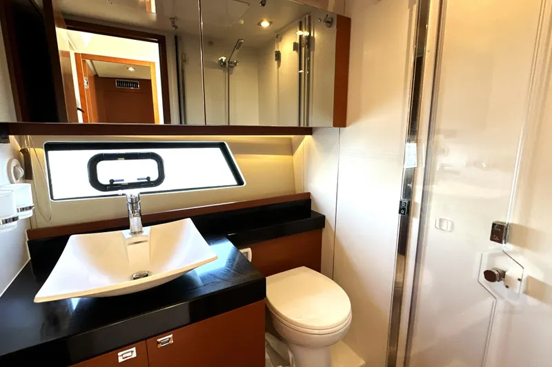 Slide: The Image of Luxurious bathroom in 2016 Prestige 500S yacht with modern fixtures and elegant design. - 37