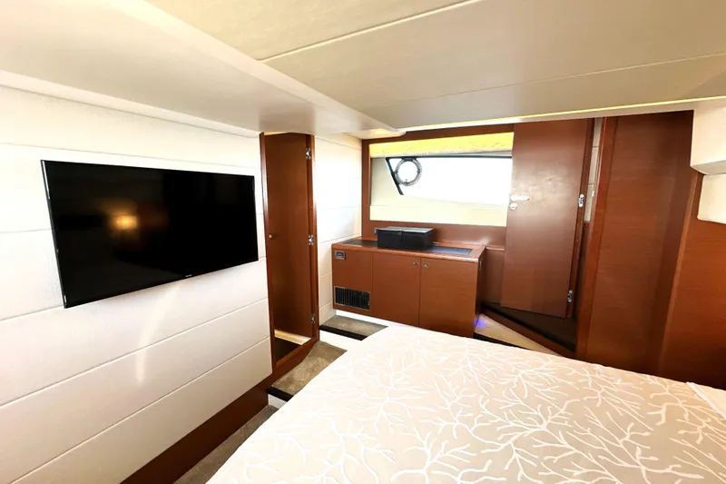 Slide: The Image of Luxurious interior of 2016 Prestige 500S yacht with TV and elegant wood finish. - 46