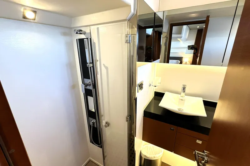 Slide: The Image of Luxurious bathroom in 2016 Prestige 500S yacht with modern shower and sleek sink design. - 48