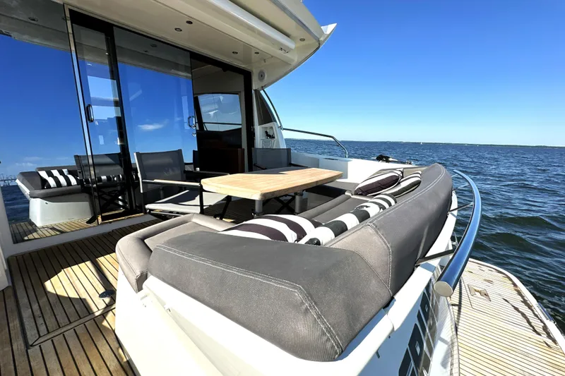 Slide: The Image of Luxurious 2016 Prestige 500S yacht deck with stylish seating and ocean view. - 9