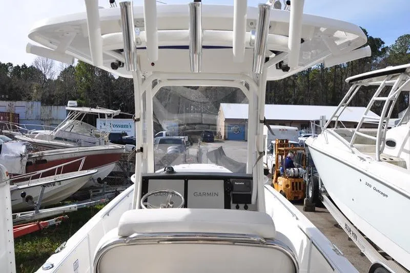 Slide: The Image of 2016 Boston Whaler 270 Dauntless boat with Garmin navigation, docked among other vessels. - 10