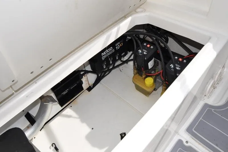 Slide: The Image of Battery compartment of 2016 Boston Whaler 270 Dauntless with Noco Genius charger. - 15