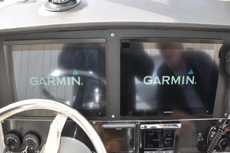 Slide: The Image of Dashboard of 2016 Boston Whaler 270 Dauntless with dual Garmin displays. - 20