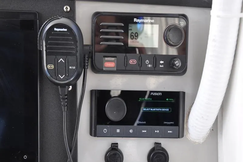 Slide: The Image of Control panel of a 2016 Boston Whaler 270 Dauntless with Raymarine and Fusion devices. - 22