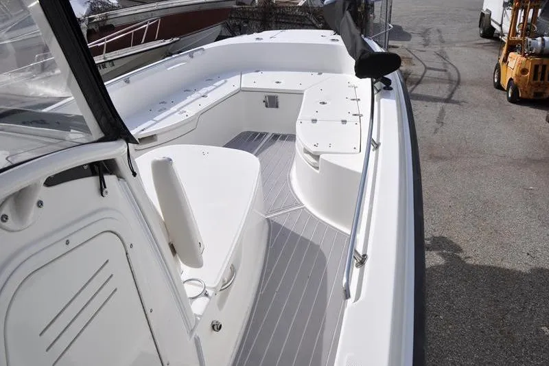Slide: The Image of 2016 Boston Whaler 270 Dauntless boat interior with seating and storage compartments. - 24