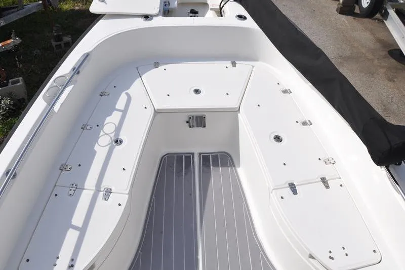 Slide: The Image of 2016 Boston Whaler 270 Dauntless boat interior with storage compartments and seating area. - 28