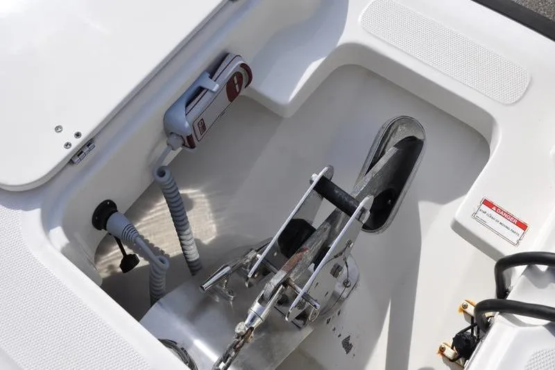 Slide: The Image of Anchor compartment of 2016 Boston Whaler 270 Dauntless boat, featuring anchor and winch system. - 34
