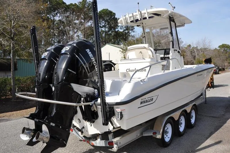 Slide: The Image of 2016 Boston Whaler 270 Dauntless boat on trailer with dual Mercury engines. - 4