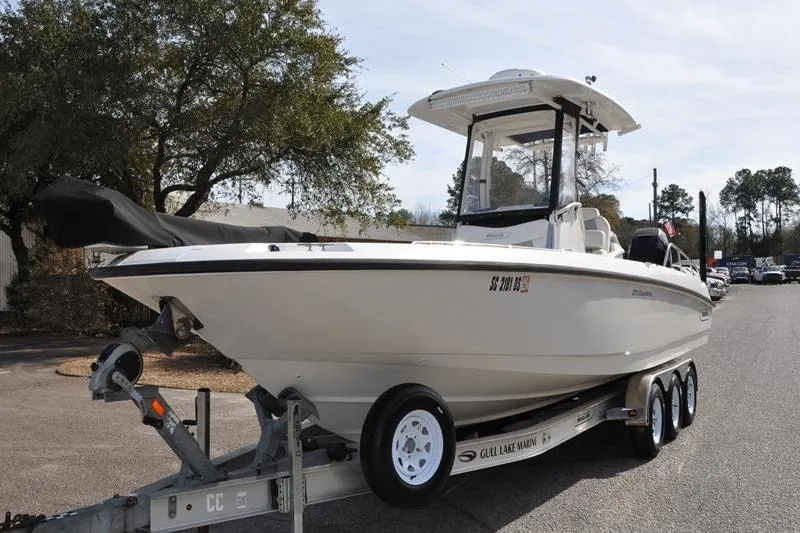 Slide: The Image of 2016 Boston Whaler 270 Dauntless boat on trailer, parked outdoors. - 8