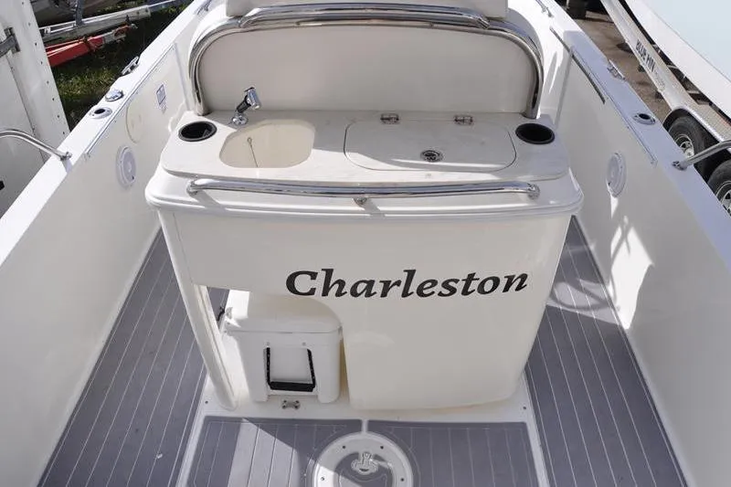 Slide: The Image of 2016 Boston Whaler 270 Dauntless boat interior with sink and storage, labeled "Charleston." - 9