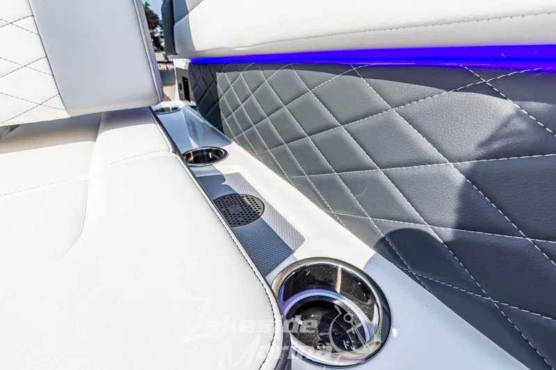 Slide: The Image of Luxurious interior of 2026 Chaparral SSX 6 boat with quilted upholstery and cup holders. - 17