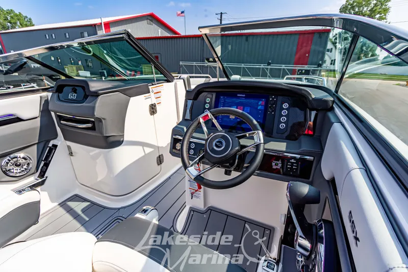 Slide: The Image of Interior view of 2026 Chaparral SSX 6 boat with modern dashboard and steering. - 18